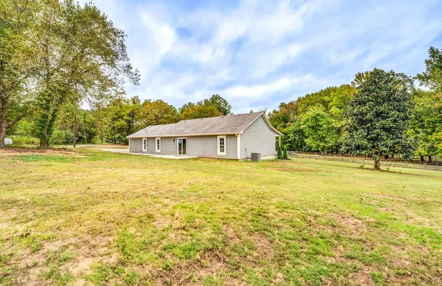 a house with trees in the background