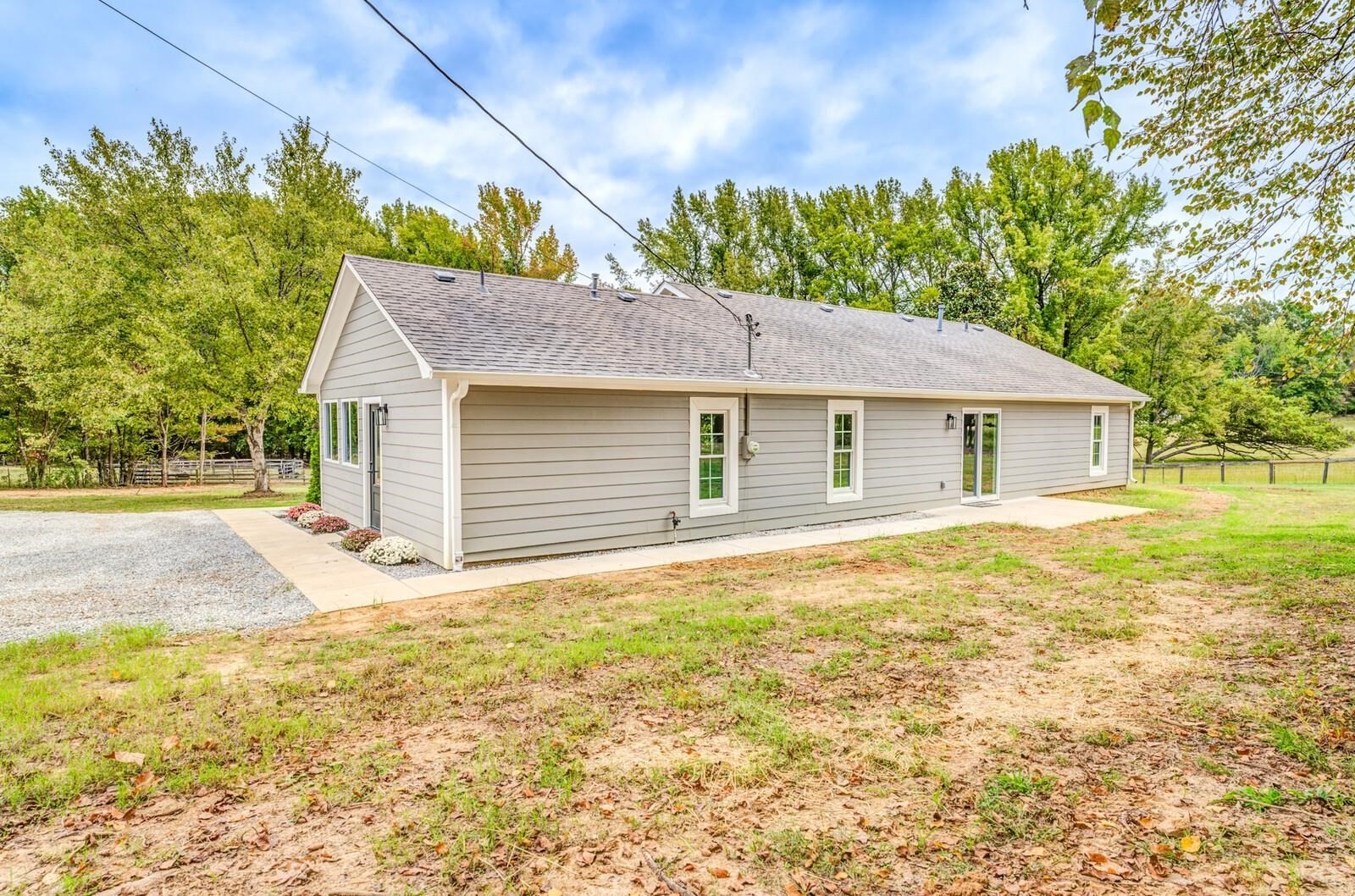 2100 Scrub Oak Road Mason, TN 38049 - Photo 26 of 28 a house with trees in the background