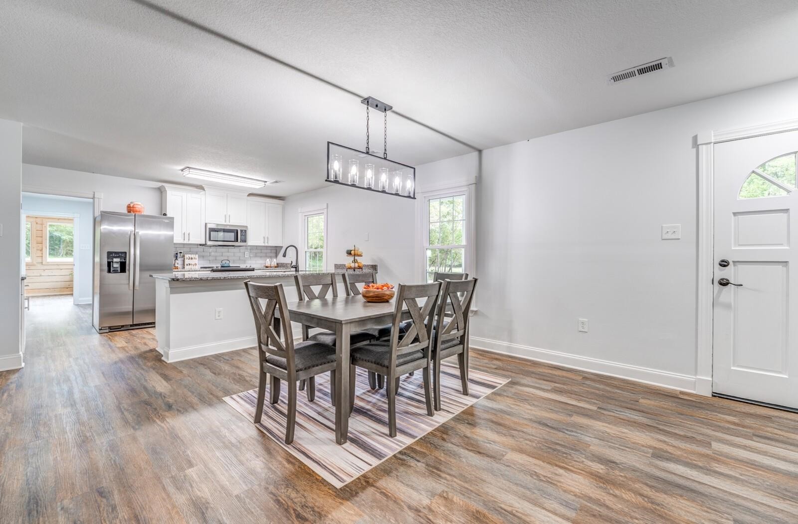 2100 Scrub Oak Road Mason, TN 38049 - Photo 6 of 28 a view of a dining room with furniture window and wooden floor