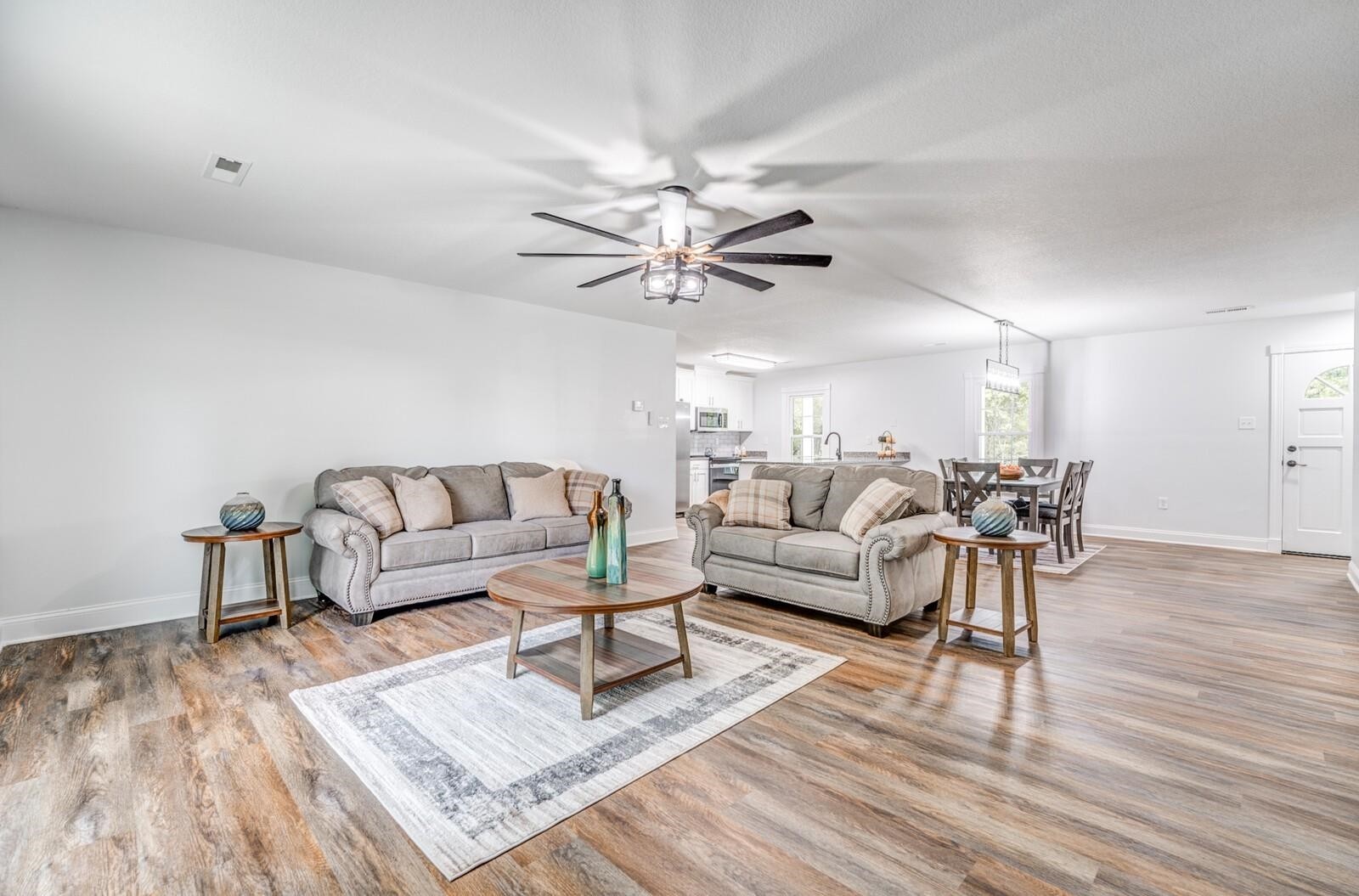 2100 Scrub Oak Road Mason, TN 38049 - Photo 9 of 28 a living room with furniture and a wooden floor