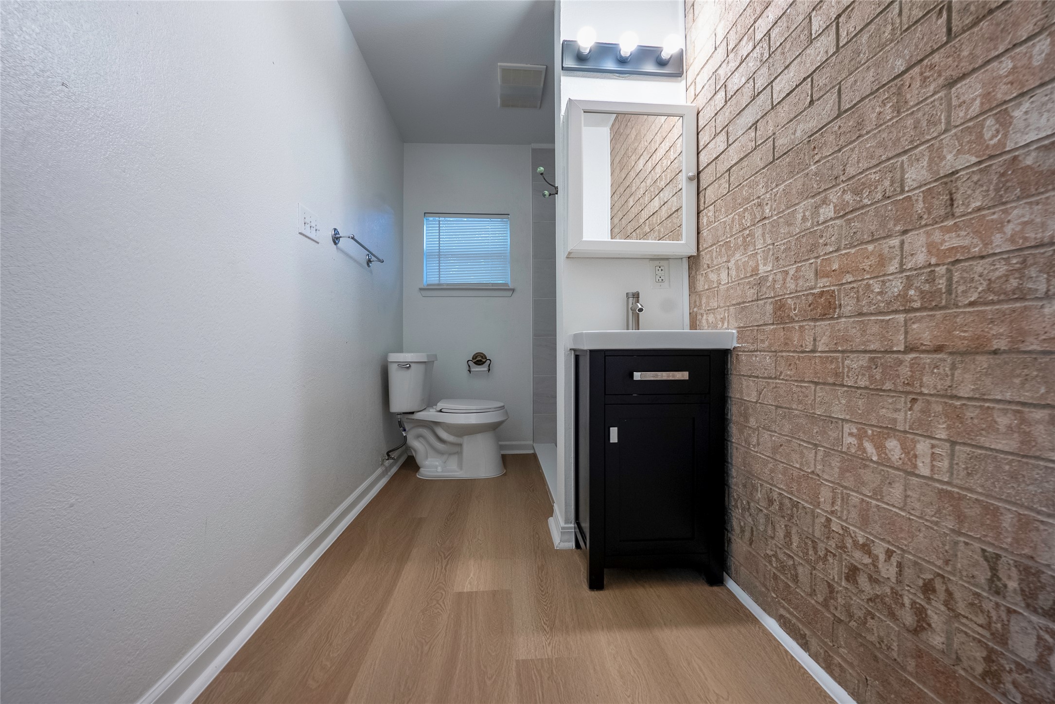 807 Country Club Road Georgetown, TX 78628 - Photo 13 of 28 a bathroom with a sink and a toilet