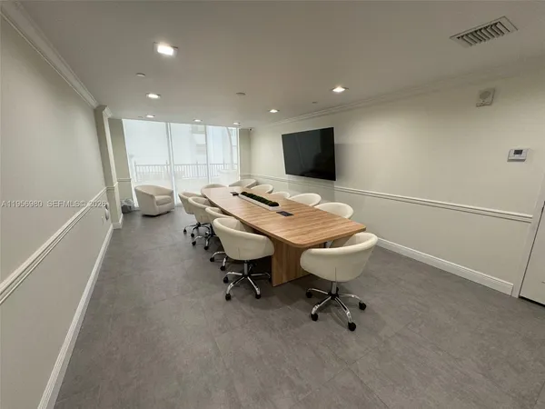 a view of a workspace with furniture