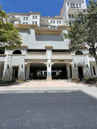 a front view of a building with garage