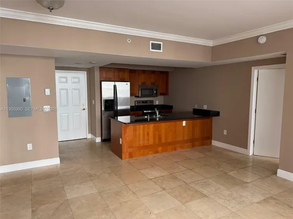 a view of kitchen with cabinets
