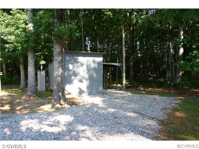 3244 Lowry Road Columbia, VA 23038 - Photo 4 of 12 a view of a yard with a tree