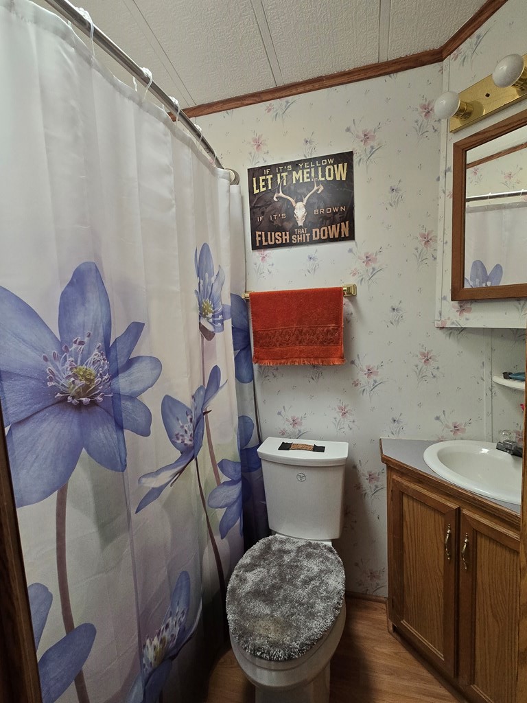 481 Twin Oaks Road Polk, PA 16342 - Photo 13 of 23 a bathroom with a toilet sink and mirror