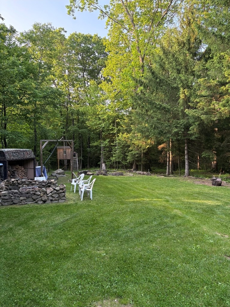 481 Twin Oaks Road Polk, PA 16342 - Photo 17 of 23 a view of a chair and table in the garden