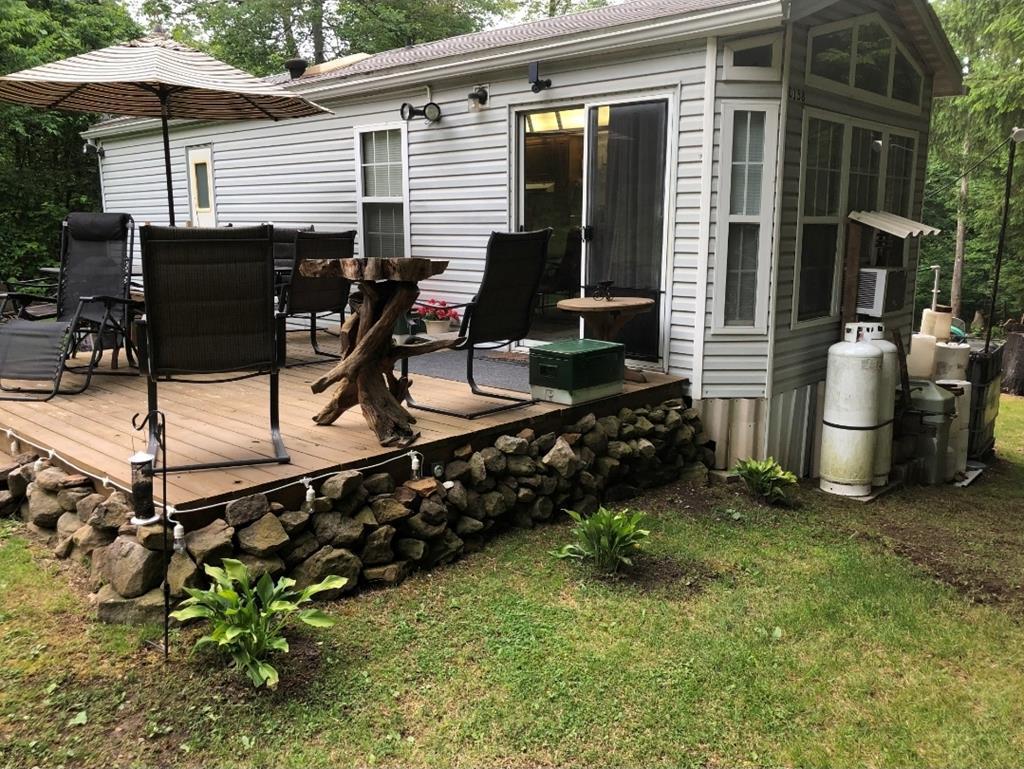 481 Twin Oaks Road Polk, PA 16342 - Photo 5 of 23 a view of a chairs and table in backyard of the house