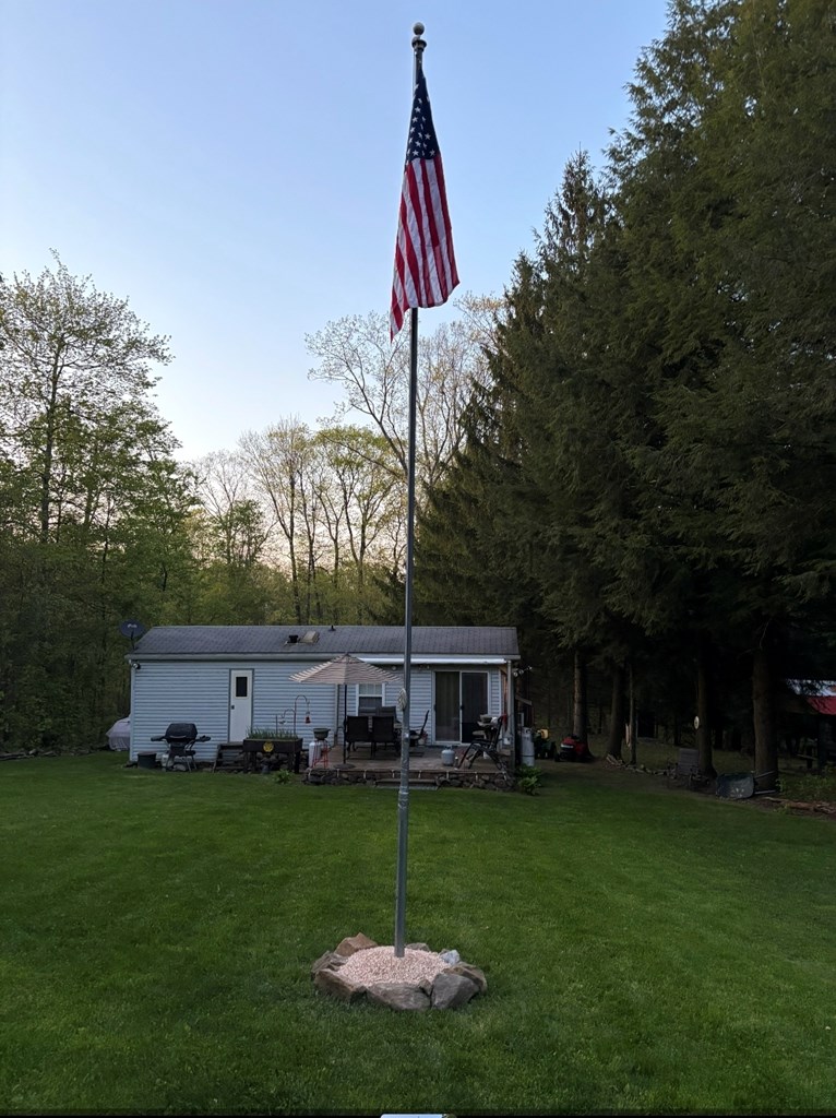481 Twin Oaks Road Polk, PA 16342 - Photo 7 of 23 a view of a house with a backyard