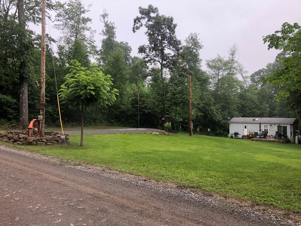 481 Twin Oaks Road Polk, PA 16342 - Photo 9 of 23 a view of a park with swings and slides