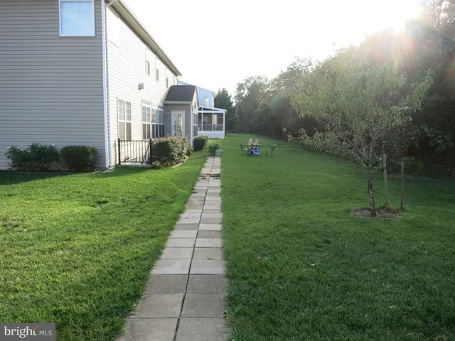 a backyard of a house with lots of green space