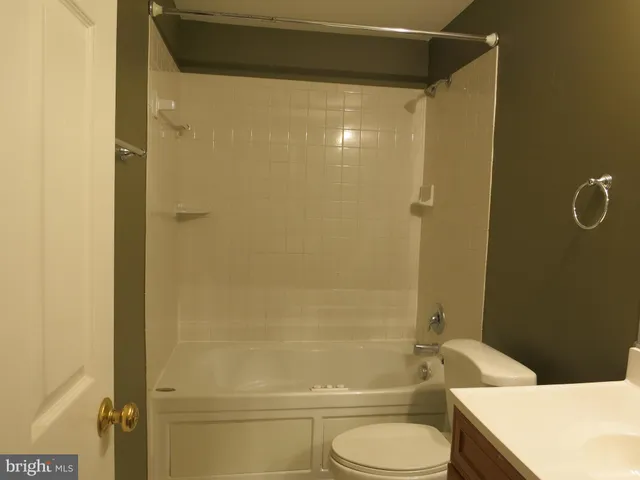 a bathroom with a shower and toilet