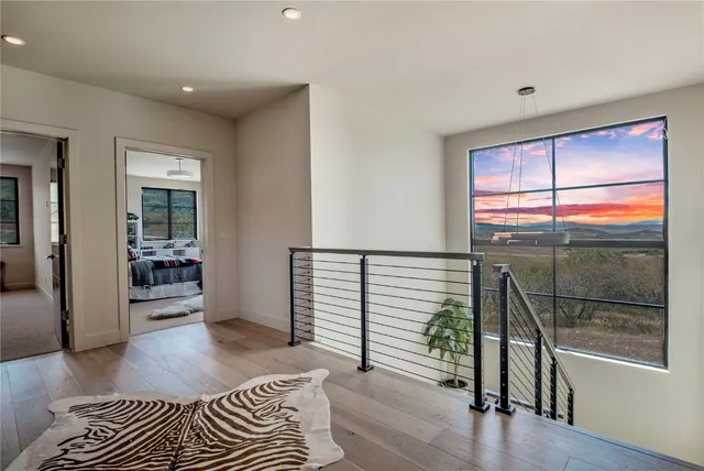 a view of a terrace with couches and sky view
