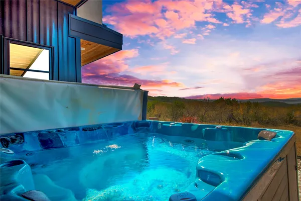 a spacious bedroom with a large bed and a dresser