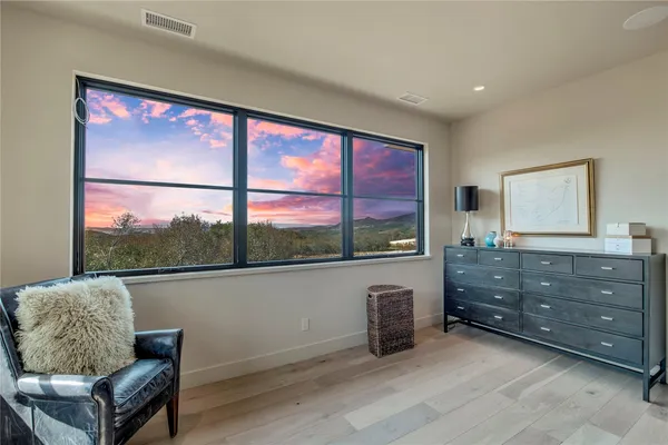 a bathroom with a bathtub sink vanity mirror and toilet