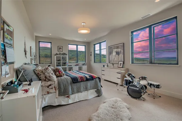 a room with gym equipment and windows