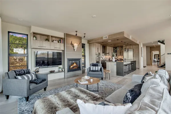 a view of swimming pool with lawn chairs