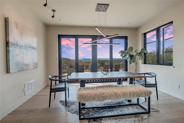 a view of a terrace with couches and sky view