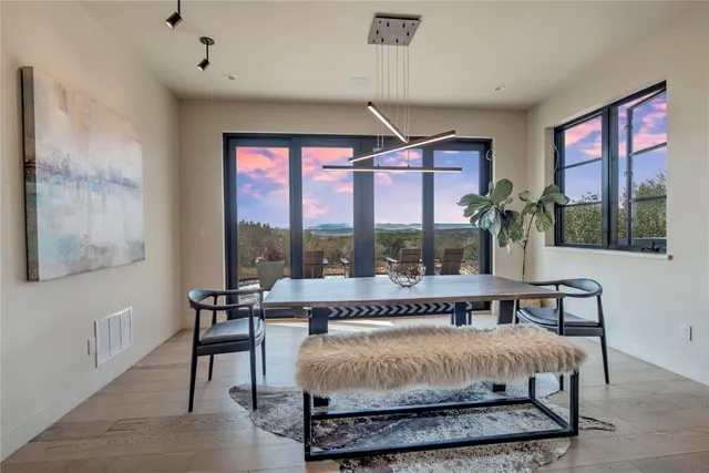 a view of a livingroom with furniture and mirror