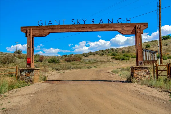 a view of a patio with couches table and chairs and wooden floor
