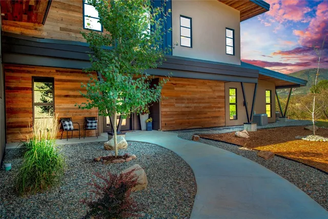 a view of a terrace with couches and sky view