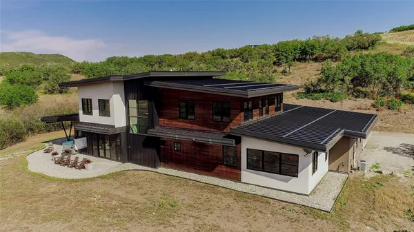 a bathroom with a sink vanity and mirror