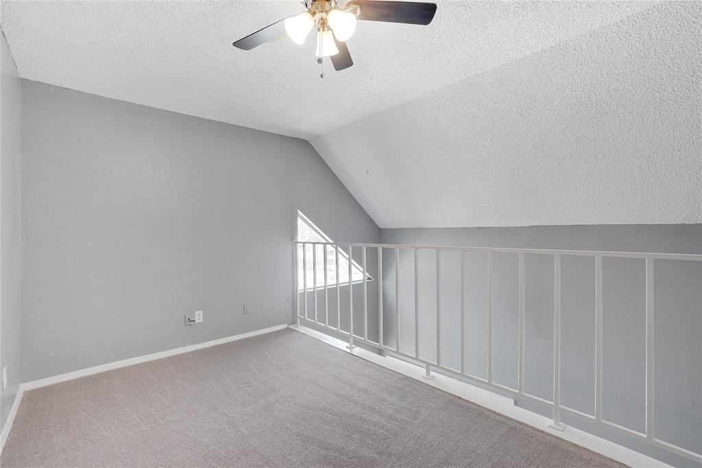 9815 Walnut Street, Unit 214 Dallas, TX 75243 - Photo 20 of 29 a view of an empty room with a window