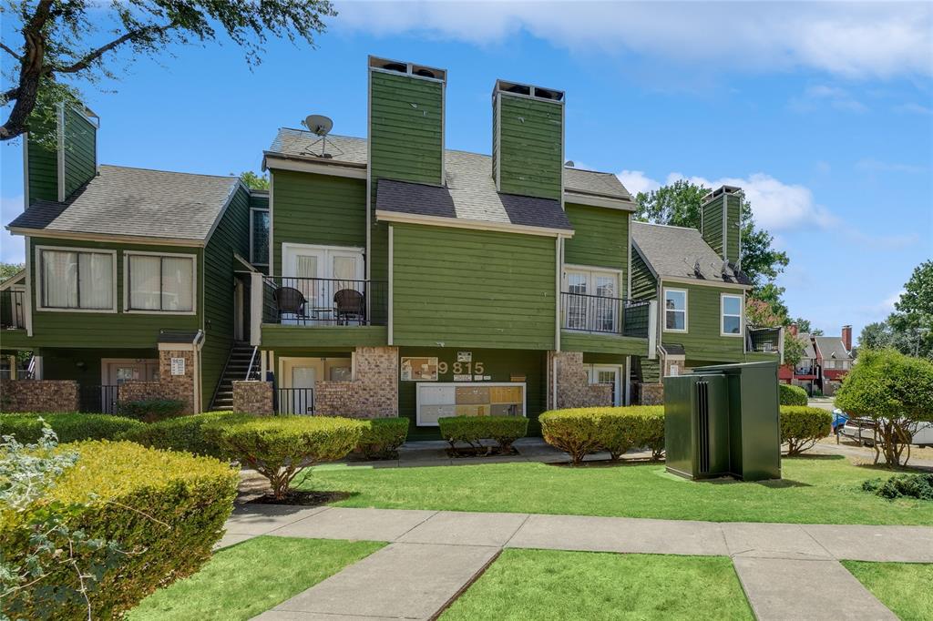 9815 Walnut Street, Unit 214 Dallas, TX 75243 - Photo 5 of 29 a front view of a house with a garden and plants