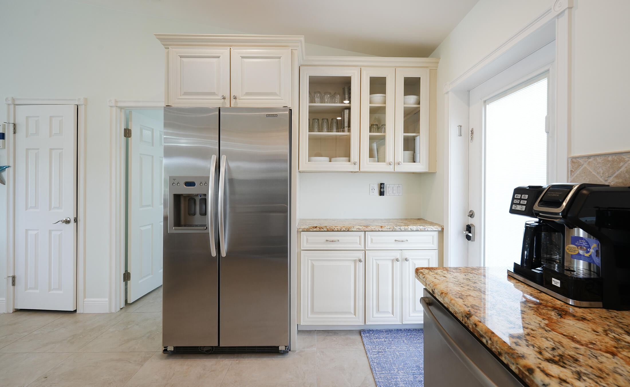 610 9th Street Key Colony Beach, FL 33051 - Photo 11 of 28 a kitchen with stainless steel appliances granite countertop a refrigerator and a stove