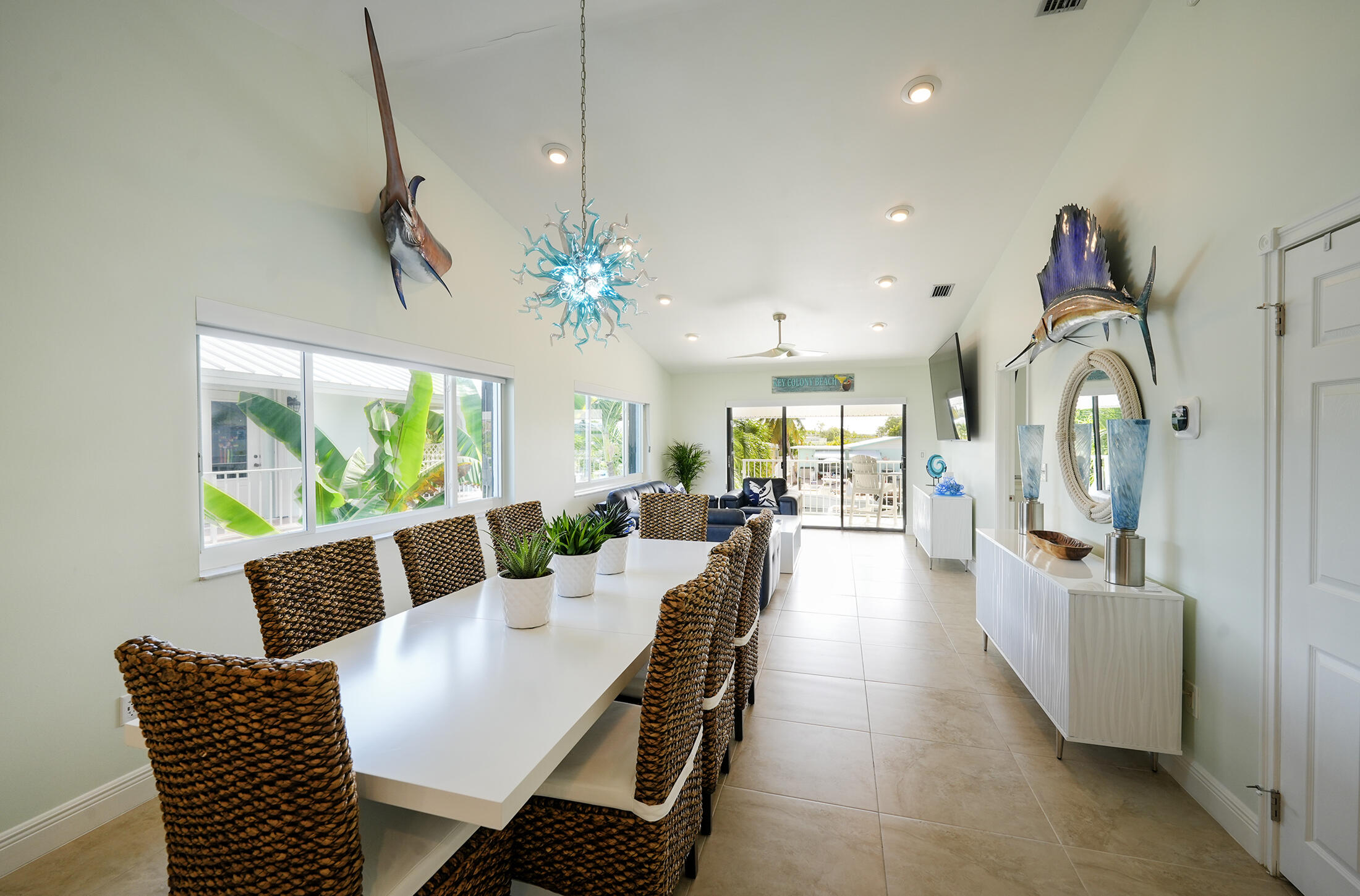 610 9th Street Key Colony Beach, FL 33051 - Photo 28 of 28 a view of a dining room with furniture a livingroom and chandelier