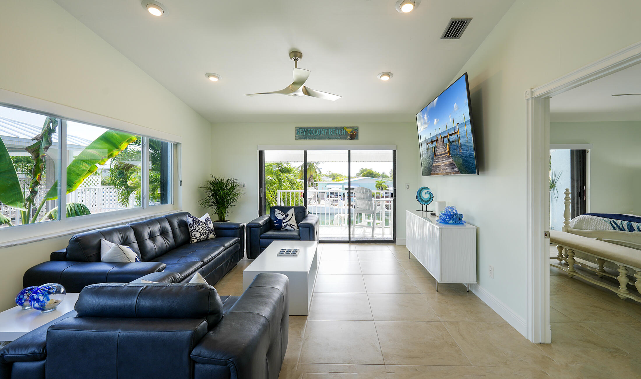610 9th Street Key Colony Beach, FL 33051 - Photo 13 of 28 a living room with furniture and a large window