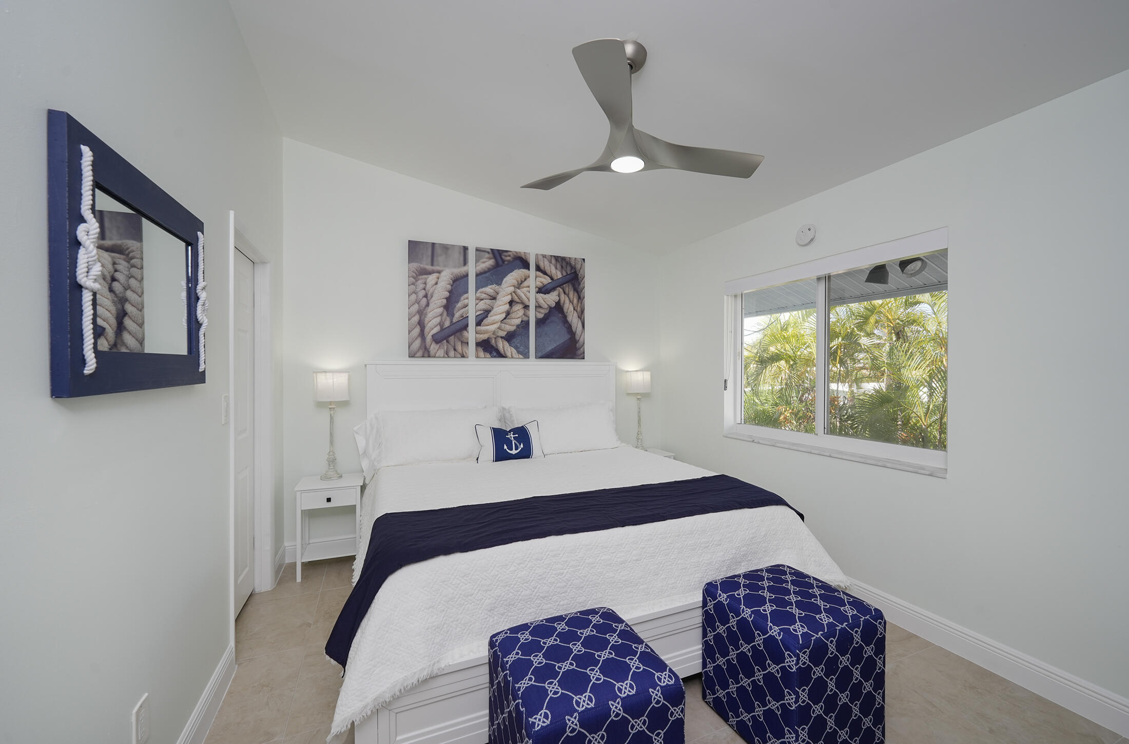 610 9th Street Key Colony Beach, FL 33051 - Photo 15 of 28 a bedroom with a bed and a painting on the wall