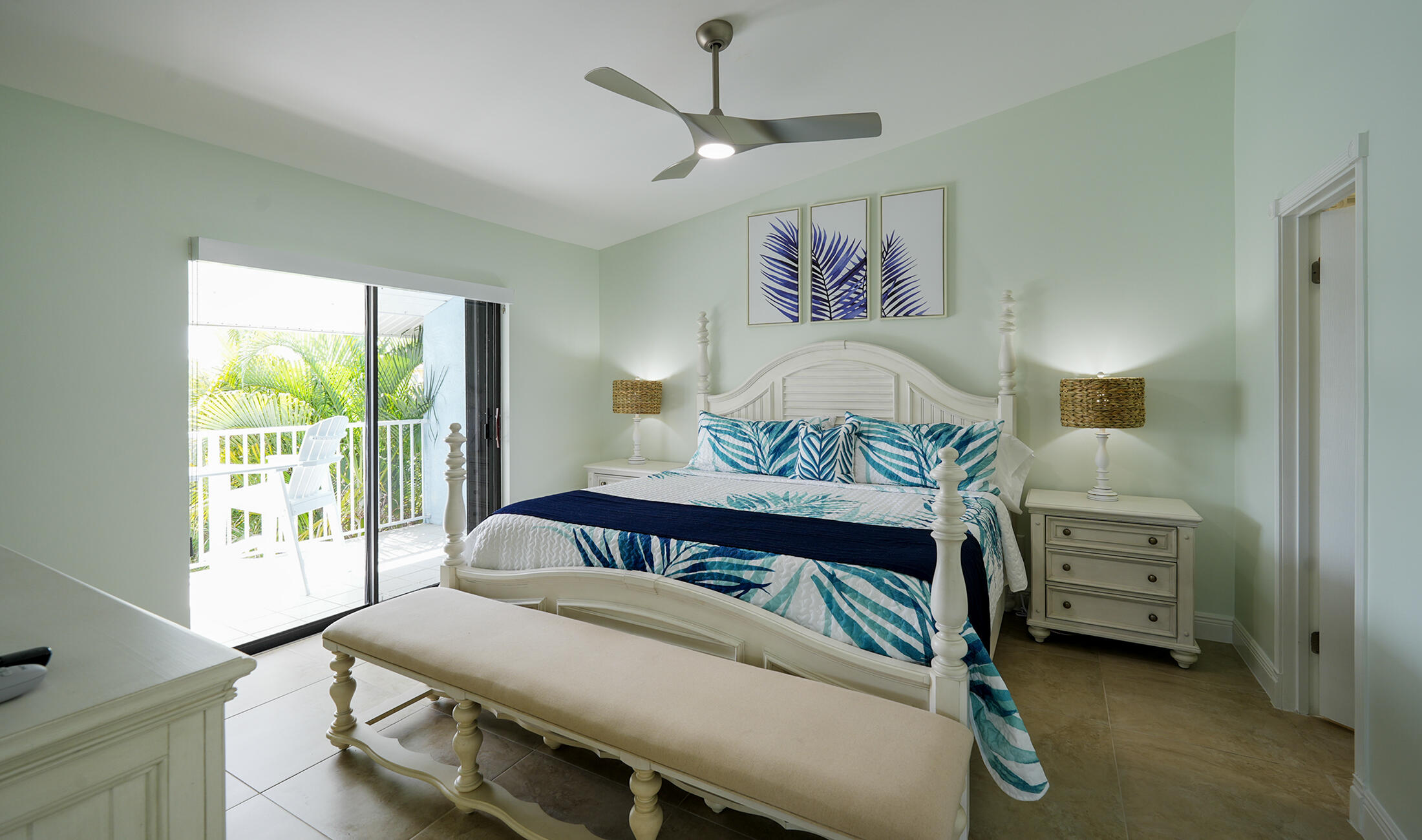 610 9th Street Key Colony Beach, FL 33051 - Photo 18 of 28 a bedroom with a bed a chandelier and a window
