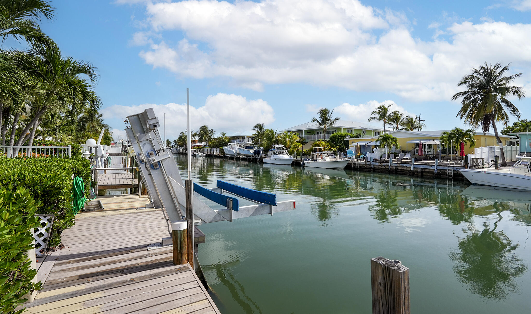 610 9th Street Key Colony Beach, FL 33051 - Photo 23 of 28 a view of a lake with a table and chairs
