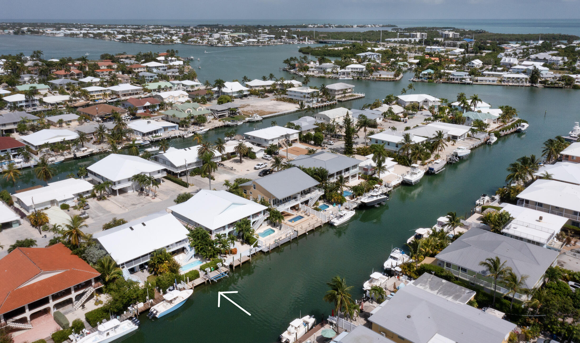 610 9th Street Key Colony Beach, FL 33051 - Photo 25 of 28 an aerial view of a city with a lake view
