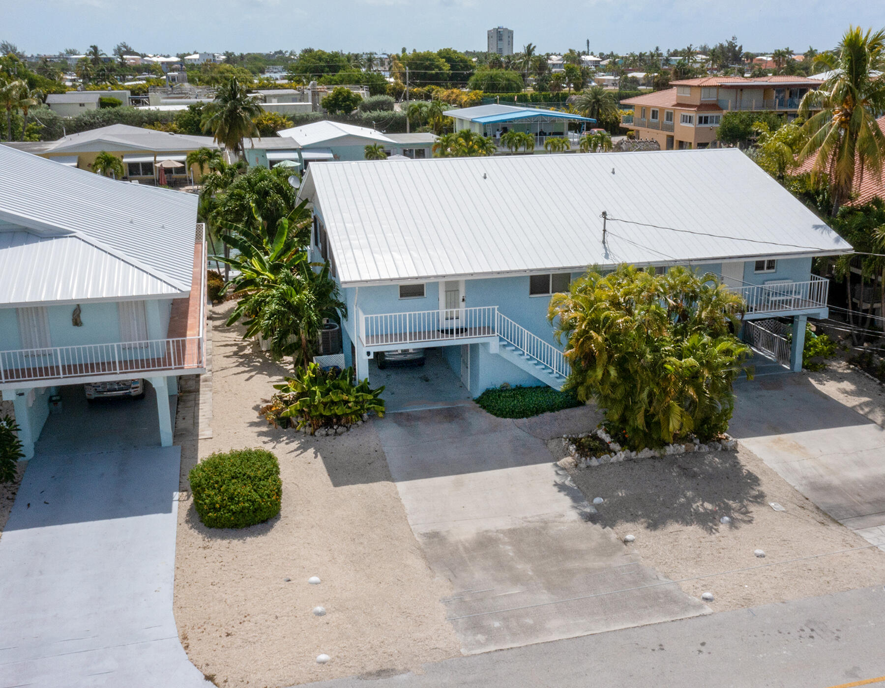 610 9th Street Key Colony Beach, FL 33051 - Photo 9 of 28 an aerial view of a house with a garden