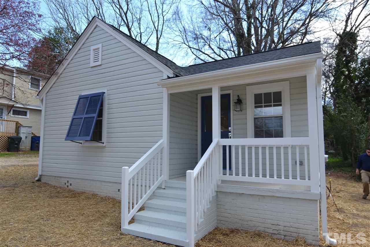 2403 Bedford Avenue Raleigh, NC 27607 - Photo 2 of 14 a view of a house with wooden deck and a yard