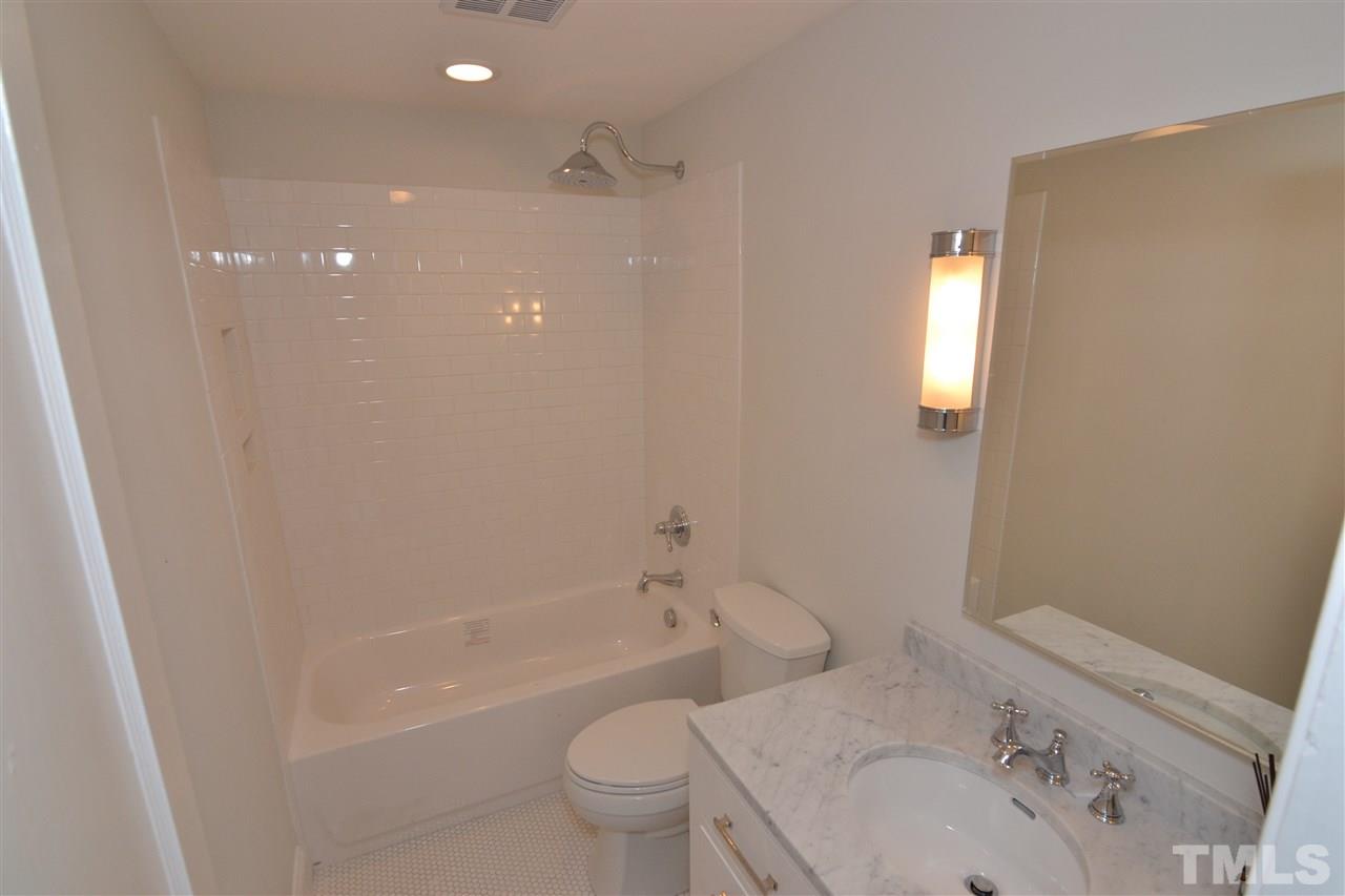 2403 Bedford Avenue Raleigh, NC 27607 - Photo 11 of 14 a bathroom with a sink toilet and shower