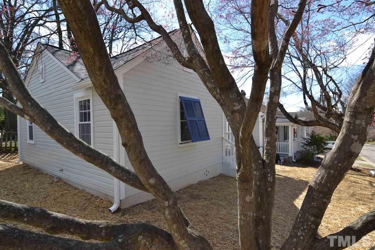 2403 Bedford Avenue Raleigh, NC 27607 - Photo 14 of 14 a view of a house with a tree next to a yard