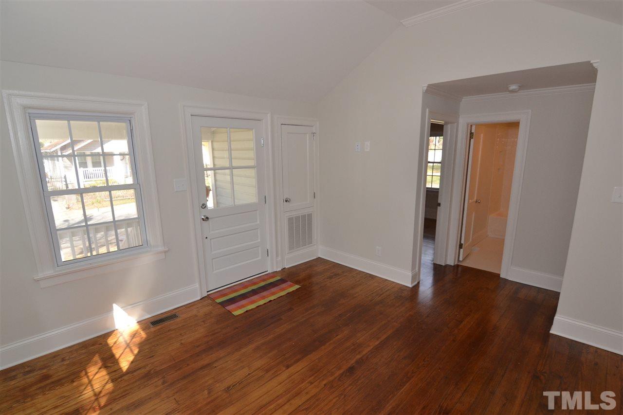 2403 Bedford Avenue Raleigh, NC 27607 - Photo 4 of 14 an empty room with wooden floor and windows