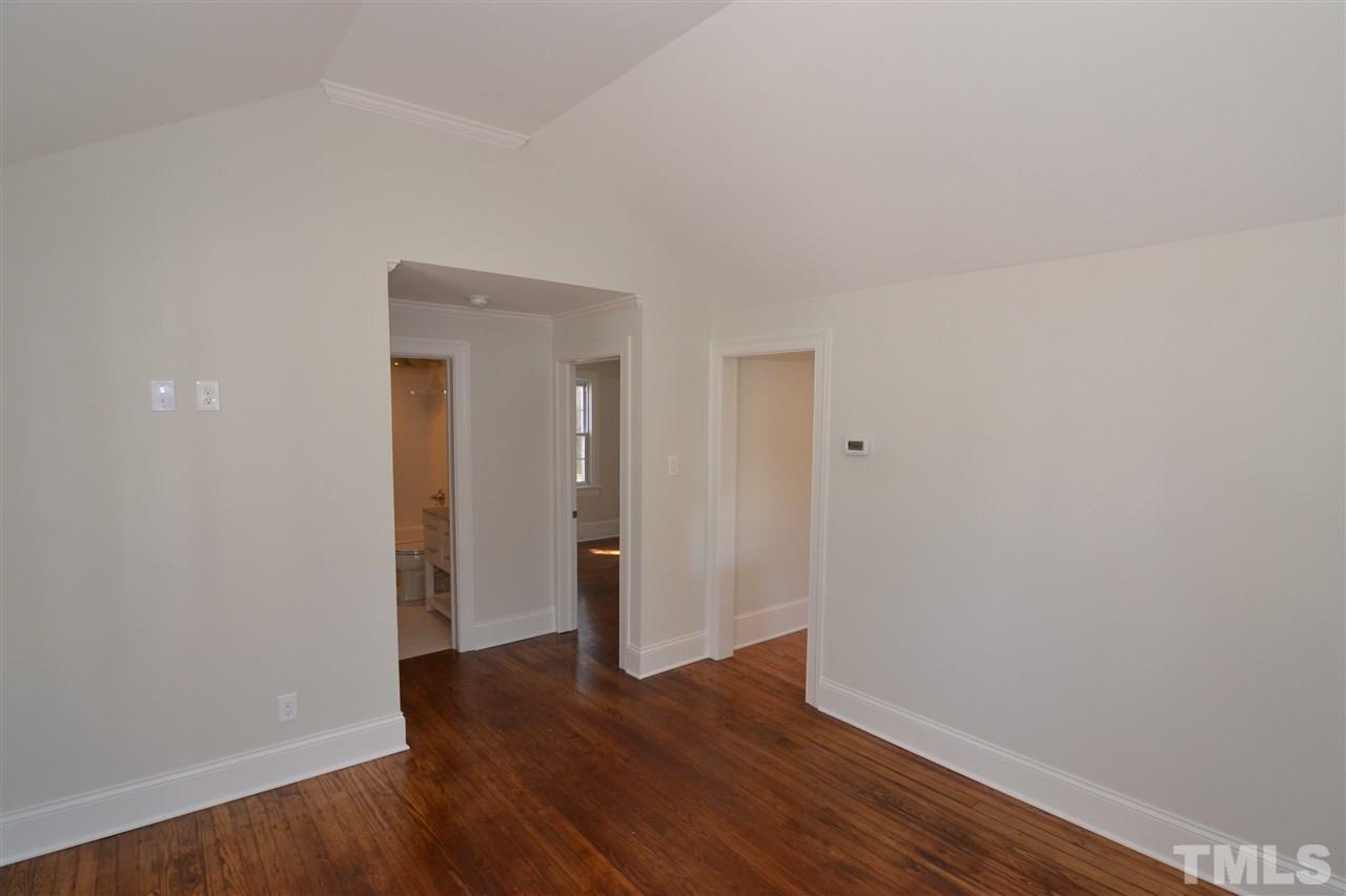 2403 Bedford Avenue Raleigh, NC 27607 - Photo 6 of 14 a view of an empty room with wooden floor