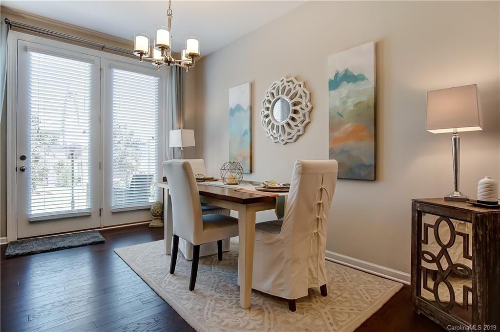 827 Ayrshire Avenue Fort Mill, SC 29708 - Photo 16 of 47 a view of a dining room with furniture window and wooden floor