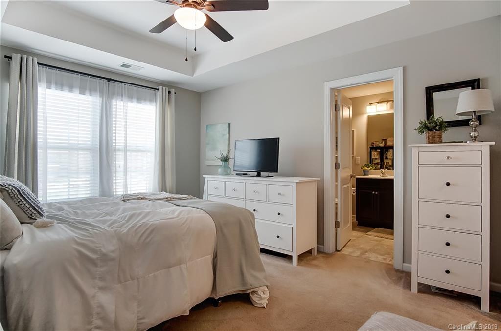 827 Ayrshire Avenue Fort Mill, SC 29708 - Photo 24 of 47 a bedroom with a bed and a flat screen tv