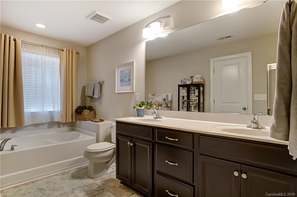 827 Ayrshire Avenue Fort Mill, SC 29708 - Photo 26 of 47 a bathroom with a sink a toilet and tub