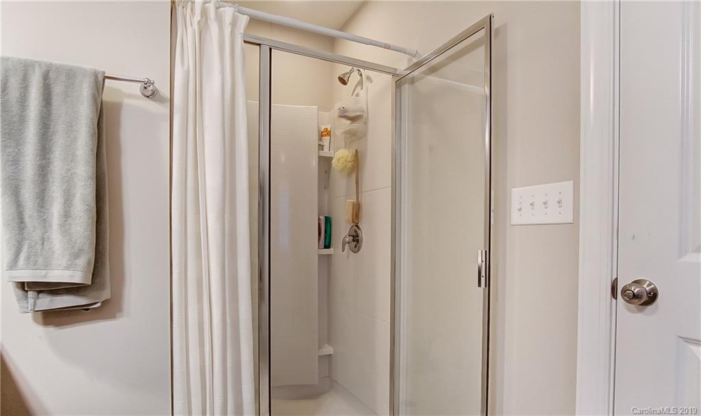 827 Ayrshire Avenue Fort Mill, SC 29708 - Photo 27 of 47 a bathroom with a shower and a mirror