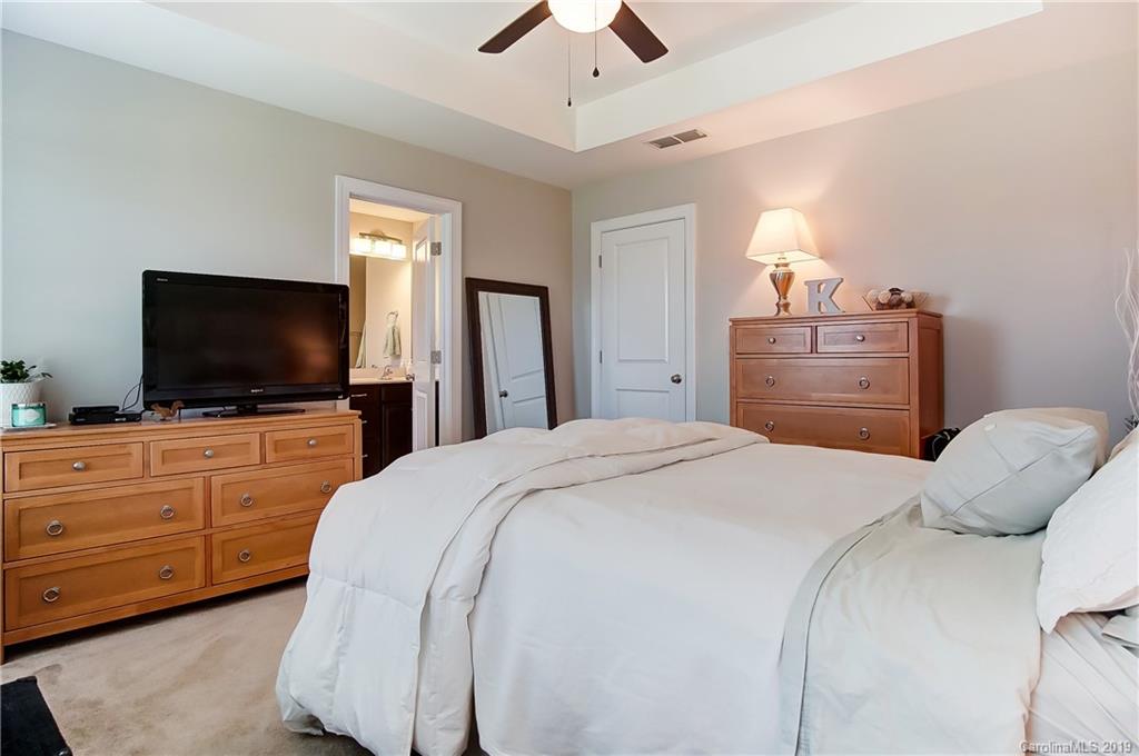 827 Ayrshire Avenue Fort Mill, SC 29708 - Photo 31 of 47 a bedroom with a bed and a flat screen tv