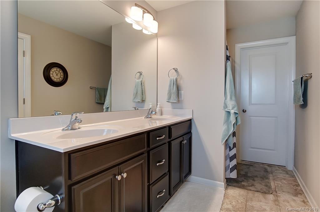 827 Ayrshire Avenue Fort Mill, SC 29708 - Photo 32 of 47 a bathroom with a sink and a mirror