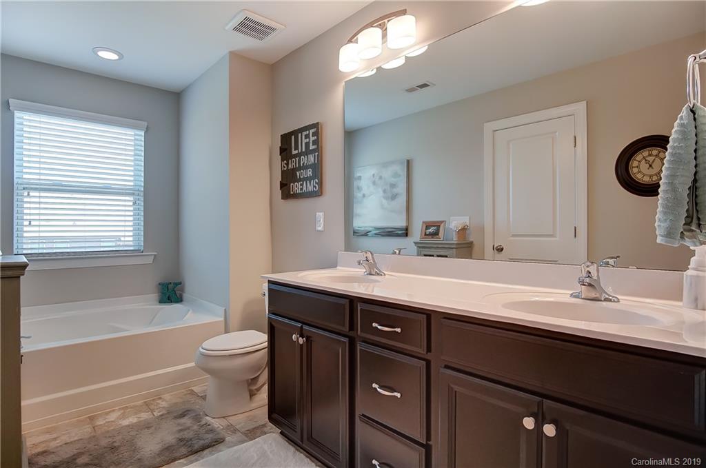 827 Ayrshire Avenue Fort Mill, SC 29708 - Photo 33 of 47 a bathroom with a double vanity sink toilet mirror and bathtub