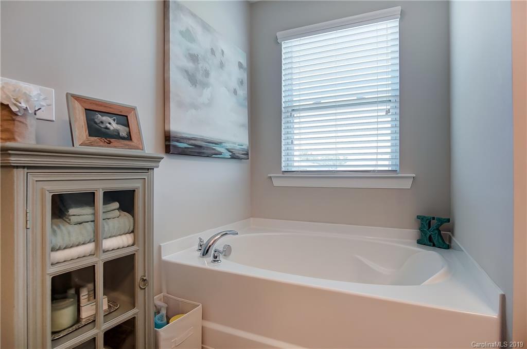 827 Ayrshire Avenue Fort Mill, SC 29708 - Photo 34 of 47 a white bath tub sitting next to a window