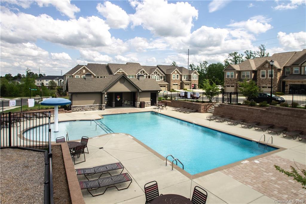 827 Ayrshire Avenue Fort Mill, SC 29708 - Photo 43 of 47 a view of a house with pool and chairs